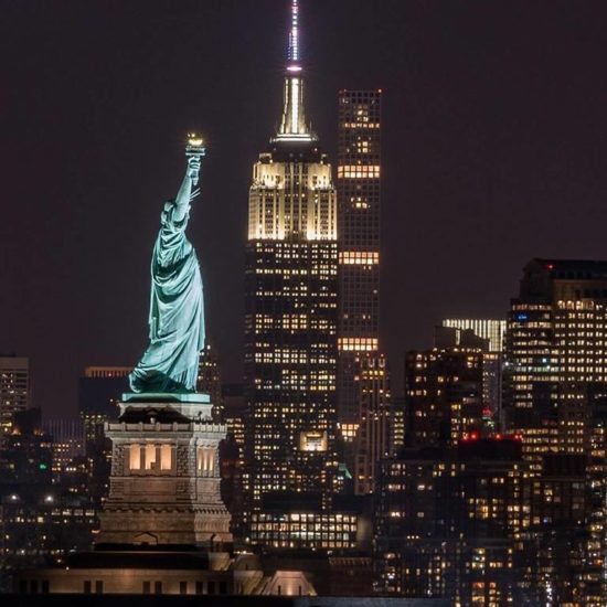 Statue of Liberty and Empire State Building NYC at night