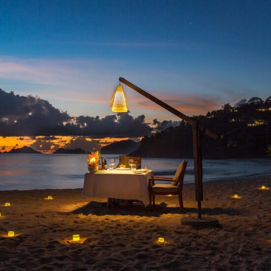 Seychelles, romantic private beach front candle light dinner