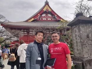 Founder of All About Tailor-Made Travel working remotely with a view of Tokyo and the Senso-ji temple