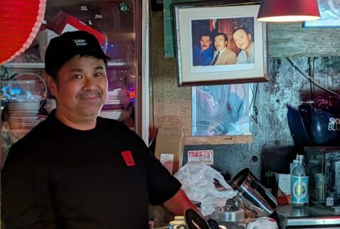 Friendly member of staff behind the counter at a gay bar in Tokyo’s Shinjuku Ni-chome district