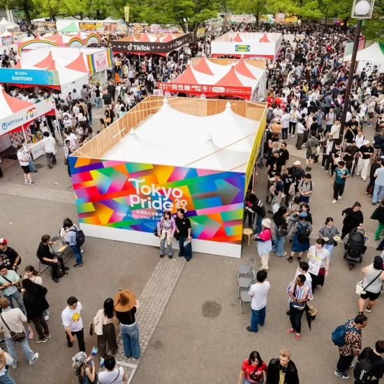 Crowds and rainbow-decorated stalls at the Tokyo Pride festival in Japan