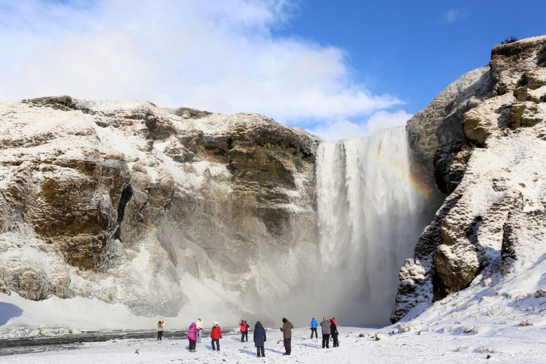 Iceland travel in a group waterfall